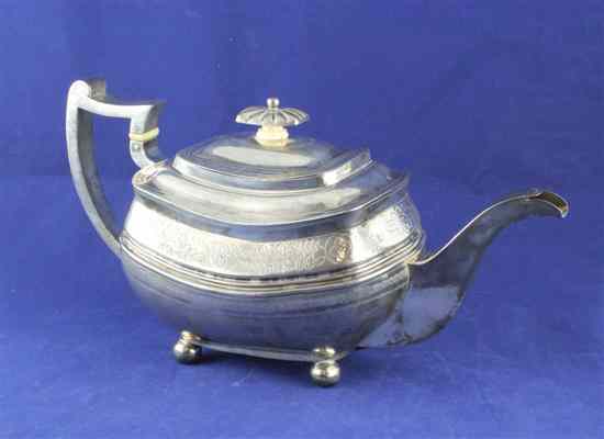 Appraisal: A George III silver teapot of rounded rectangular form engraved