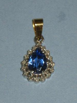 Appraisal: A SAPPHIRE AND DIAMOND PENDANT the pear cut pale sapphire