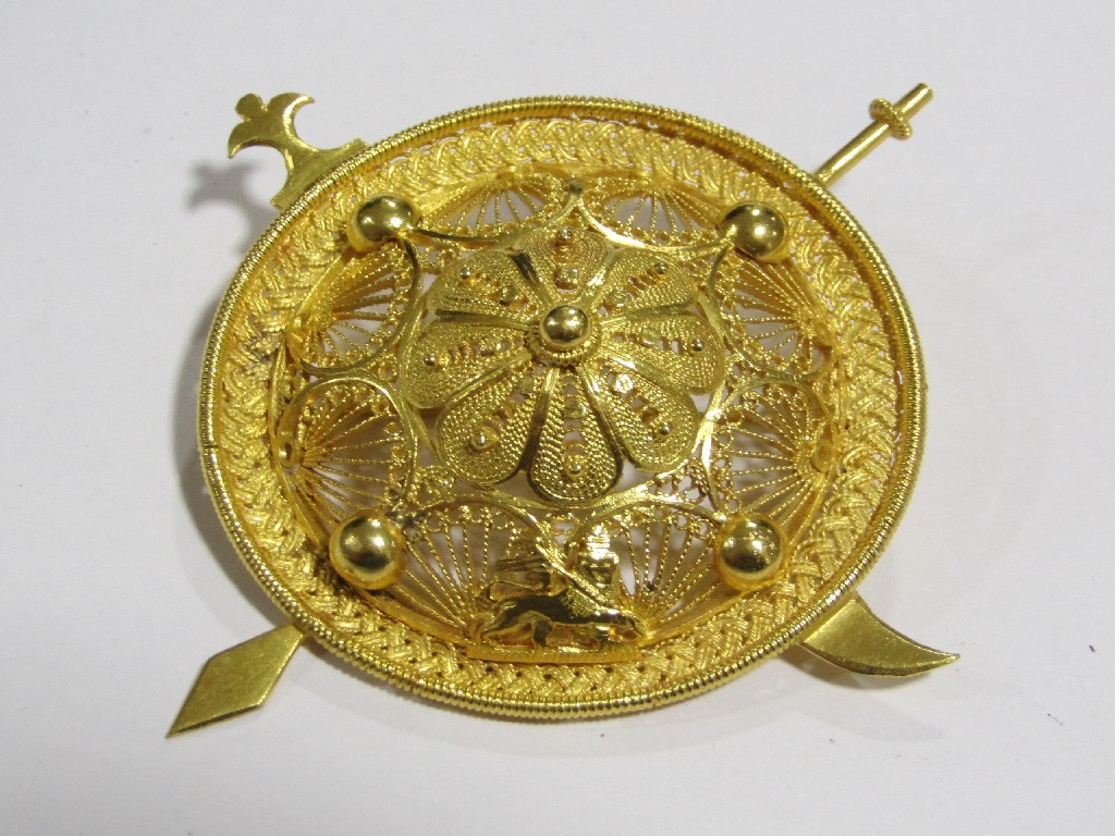 Appraisal: African gold filigree work shield brooch Approximately gms tests for