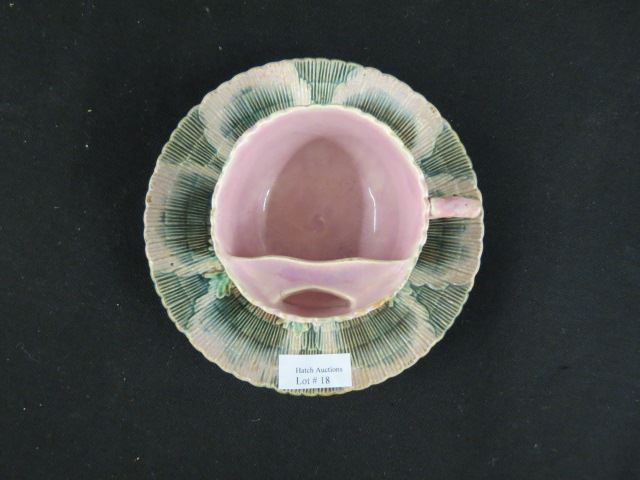 Appraisal: Majolica Pottery Seaweed and Shell Mustache Cupand Saucer scarce form