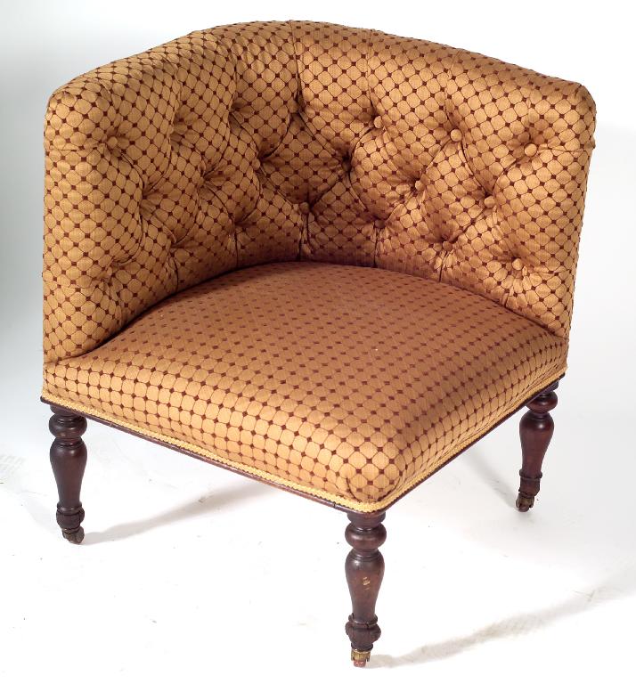 Appraisal: VICTORIAN DEEP-BUTTONED CORNER CHAIR raised on turned legs moving on