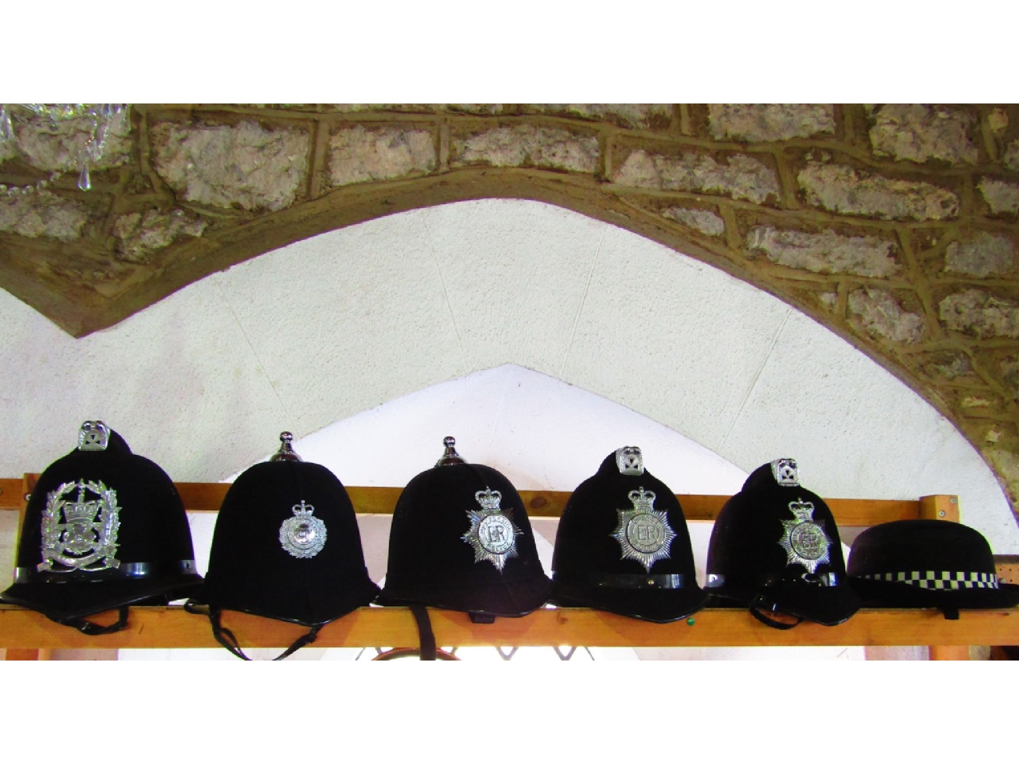 Appraisal: Five policeman's constabulary helmets Merseyside Dorset Humberside Devon and Hampshire