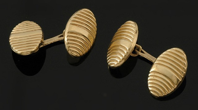 Appraisal: A pair of gold cufflinks The double ended oval cufflinks