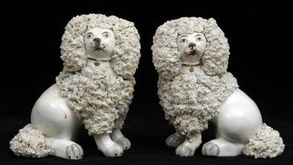 Appraisal: PAIR OF ENGLISH PORCELLANEOUS FIGURES OF SEATED POODLES Each with