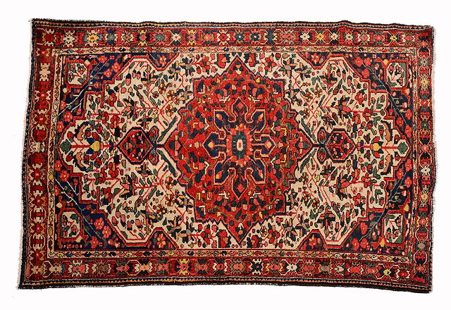 Appraisal: A BAKHTIARI WHITE GROUND RUG with a central rose medallion