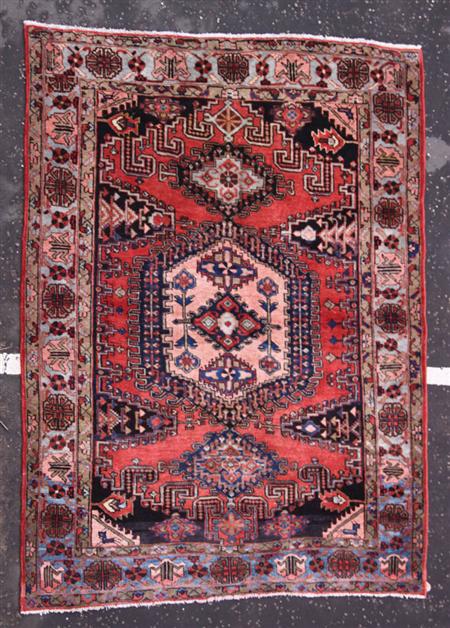 Appraisal: A Northwest Persian carpet modern the red field with salmon