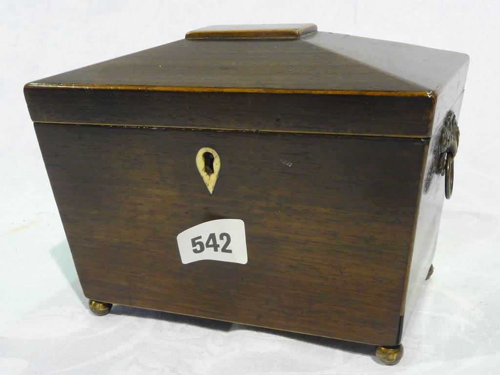 Appraisal: A rosewood sarcophagus shaped tea caddy complete with original interior