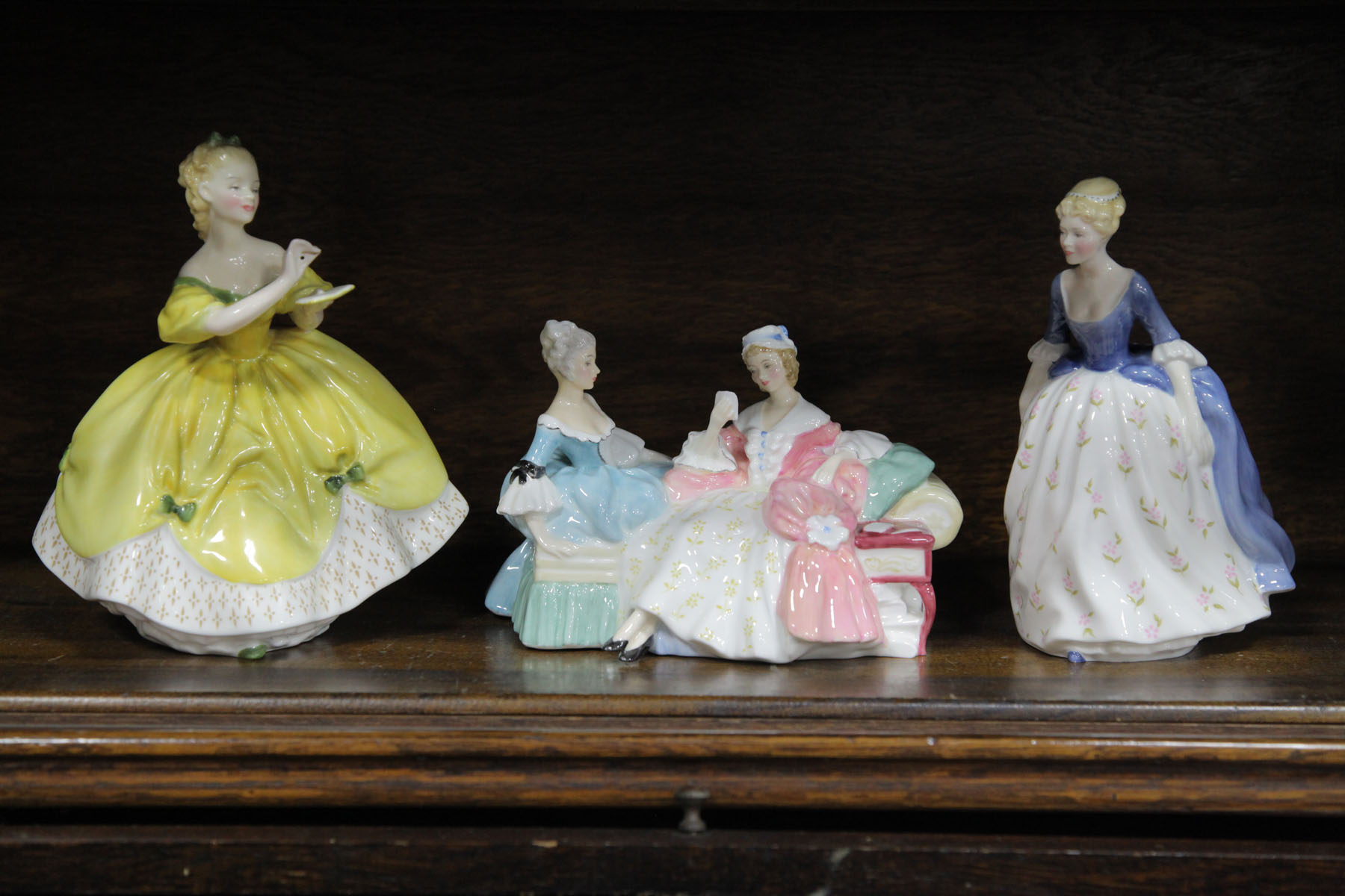 Appraisal: THREE ROYAL DOULTON FIGURES English th century The Last Waltz