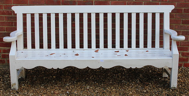 Appraisal: A WHITE PAINTED GARDEN BENCH with slatted back and seat