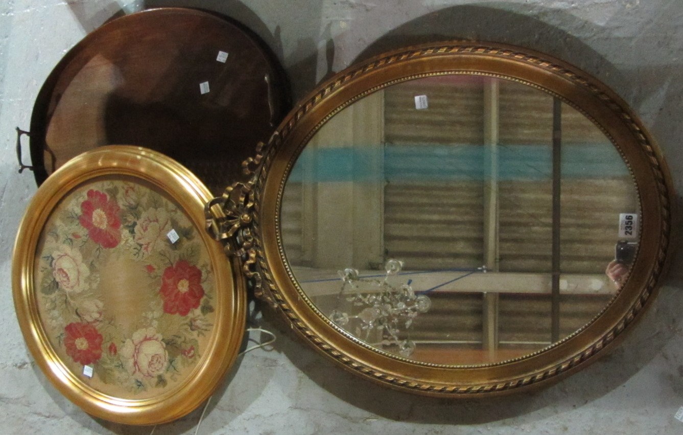 Appraisal: An oval mirror a twin handled oval galleried tray and