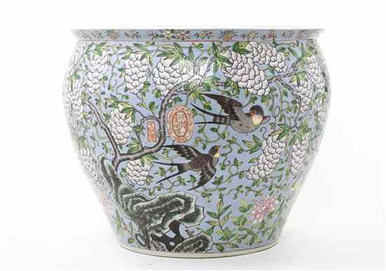 Appraisal: A Chinese Porcelain Fish Bowl with wysteria atop a pale