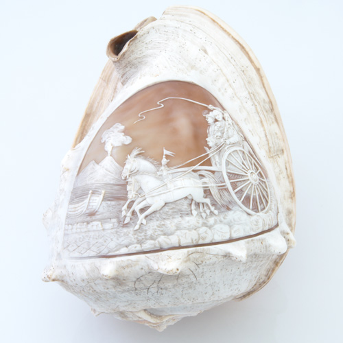 Appraisal: Cameo carved helmet shell depicting a family in horse-drawn coach