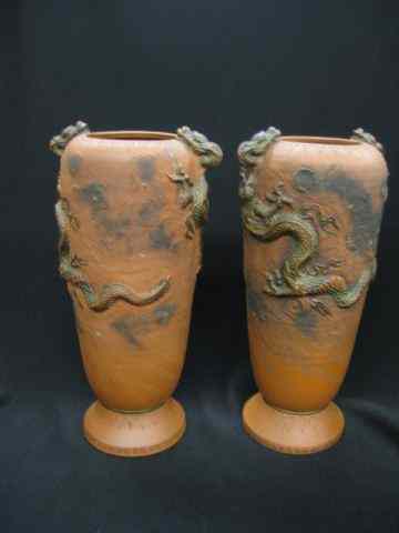 Appraisal: Pair of Oriental Terra Cotta Vases with dragondecor heads emerging