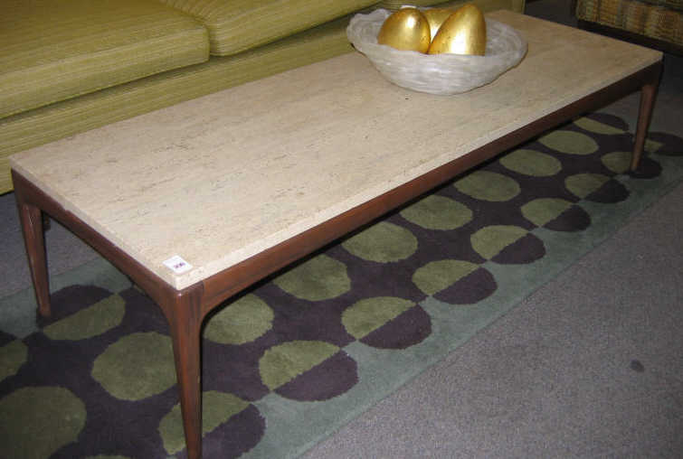 Appraisal: TRAVERTINE TOP COFFEE TABLE the rectangular top resting on the