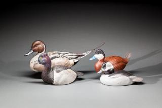 Appraisal: Four Waterfowl Carvings A decorative ring-necked drake decoy by Herb