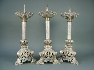 Appraisal: Three late th century Gothic style plated bronze pricket candlesticks