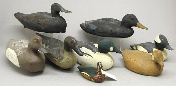 Appraisal: A group of eight carved and painted wood duck decoys