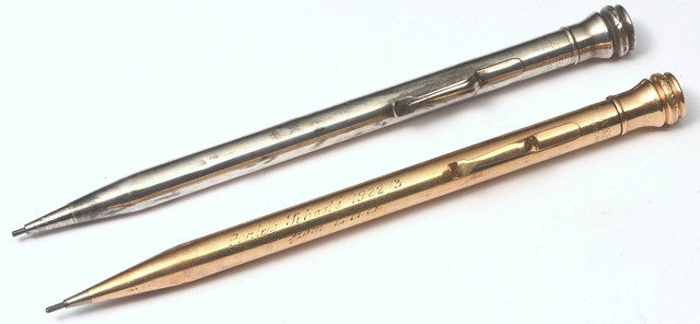 Appraisal: A GOLD PLATED PROPELLING PENCIL with presentation inscription together with