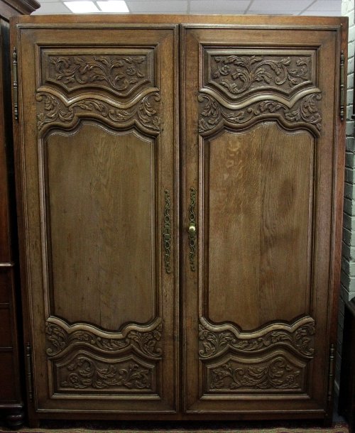 Appraisal: A French provincial walnut armoire cm high