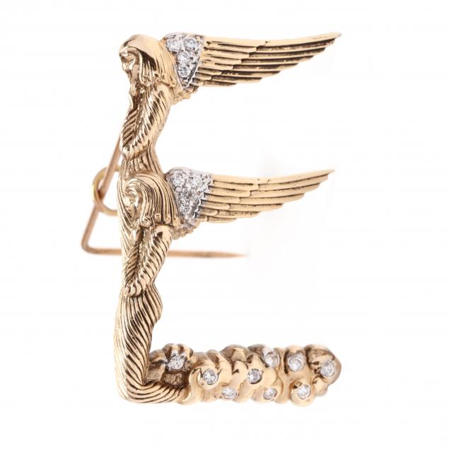 Appraisal: Gold and Diamond E Monogram Brooch Erte Designed in textured