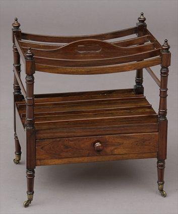 Appraisal: REGENCY ROSEWOOD CANTERBURY With pierced dividers and ring-turned supports above