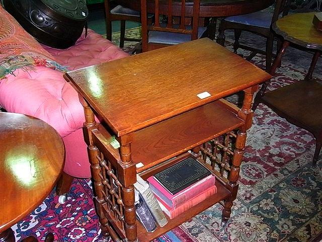 Appraisal: AN ARTS AND CRAFTS OAK ETAGERE with sloping top attributed