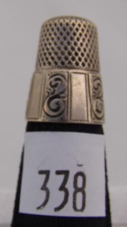 Appraisal: Thimble with wide panel band