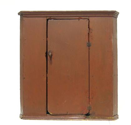 Appraisal: Red painted hanging corner cupboard possibly pennsylvania Molded cornice above