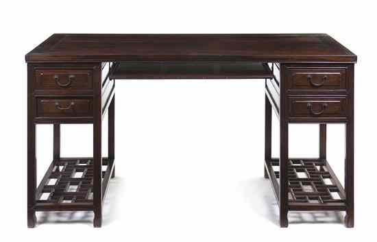 Appraisal: A Chinese Hardwood Pedestal Desk the top of rectangular form