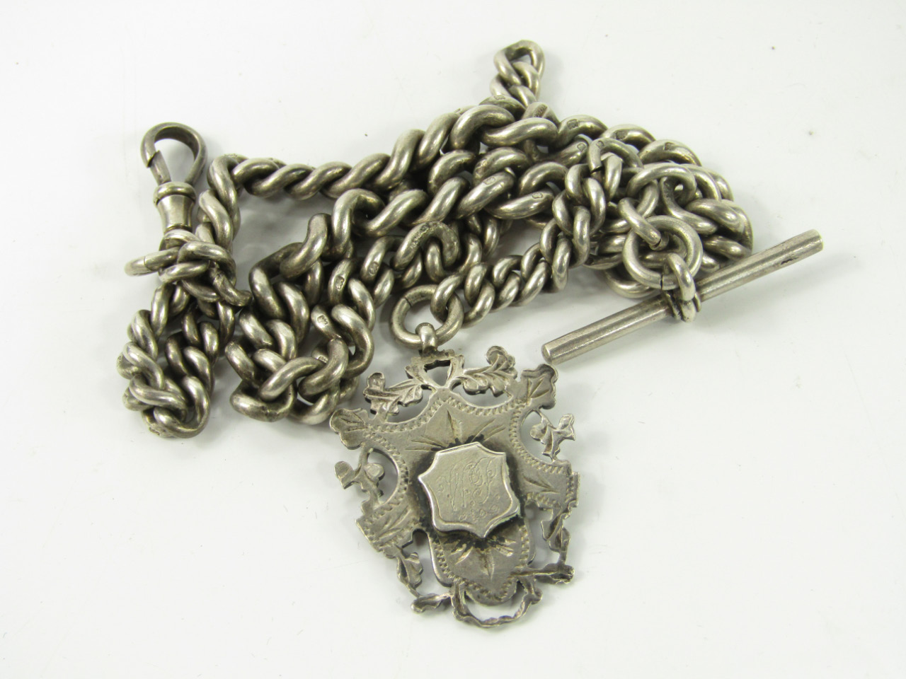 Appraisal: A silver curb link Albert chain on a snap clasp