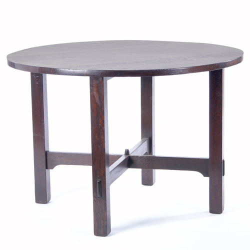 Appraisal: GUSTAV STICKLEY Game table with a circular top and arched