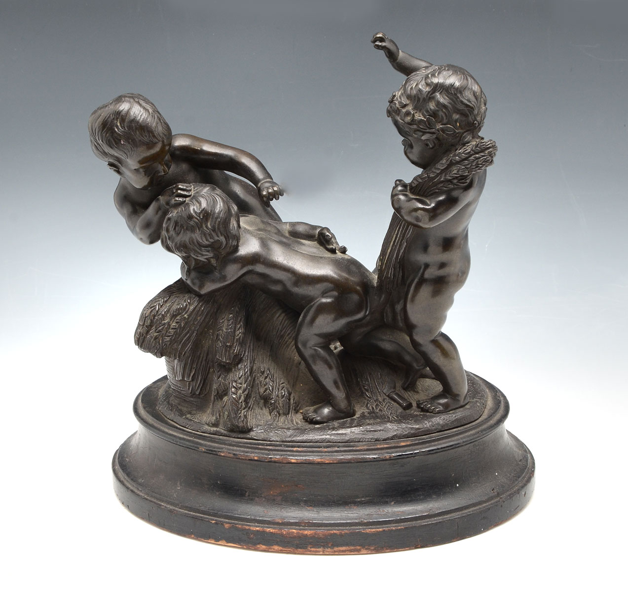 Appraisal: BRONZE FIGURAL GROUPING OF CHERUBS HARVESTING WHEAT Circa late th