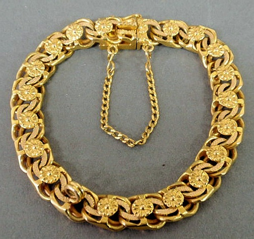 Appraisal: Ladies k gold bracelet with rosette detail and a fixed