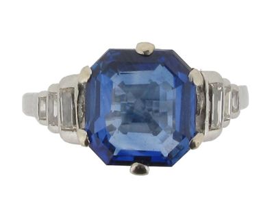 Appraisal: A sapphire and diamond ring The octagonal cut sapphire is