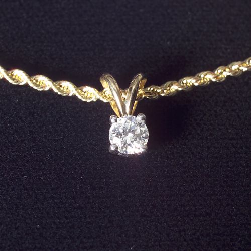 Appraisal: Diamond solitaire pendant Approx ct on an rope link chain