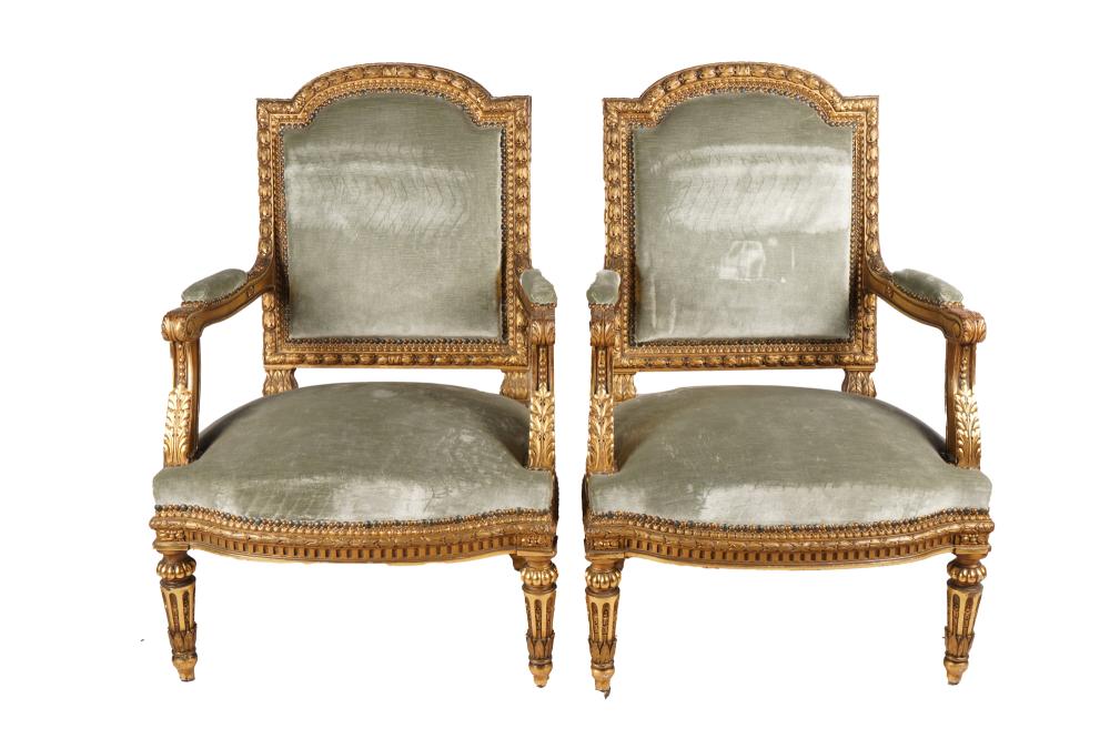 Appraisal: PAIR OF LOUIS XVI STYLE CARVED GILTWOOD FAUTEUILScovered in celadon