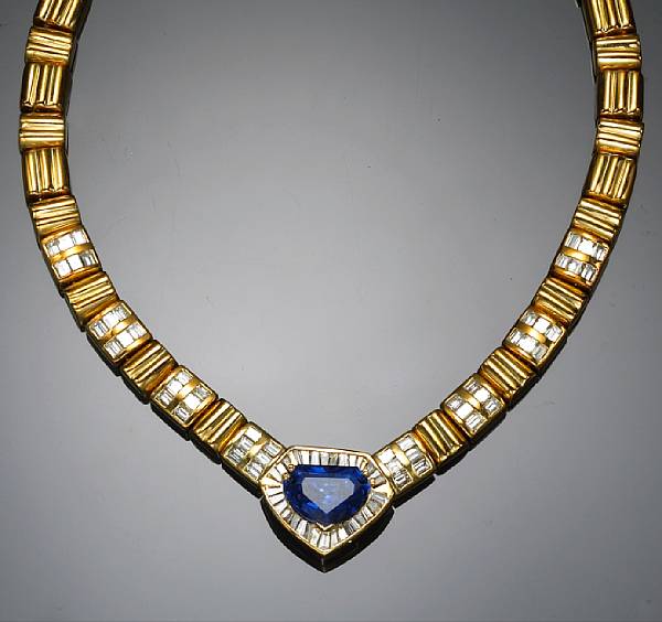 Appraisal: A sapphire and diamond necklace centering a shield-shape sapphire measuring