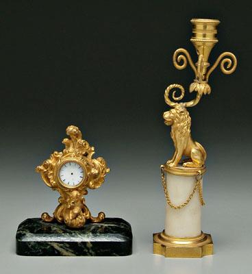 Appraisal: French candlestick clock ormolu mounted candlestick lion mount above circular