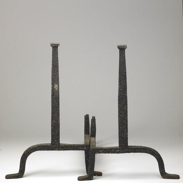 Appraisal: GUSTAV STICKLEY Attr Forged iron andirons with an unusual irregular