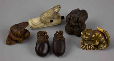 Appraisal: AN ECLECTIC GROUP OF FOUR NETSUKE including a stained ivory