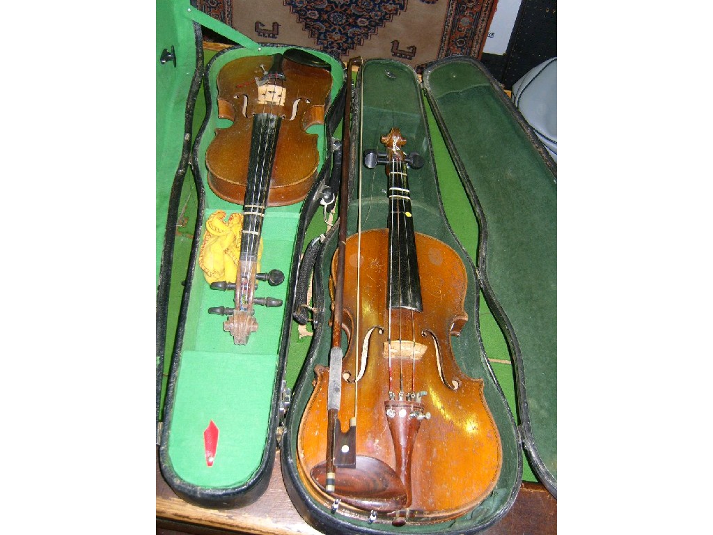 Appraisal: A cased Chinese made violin and bow together with a