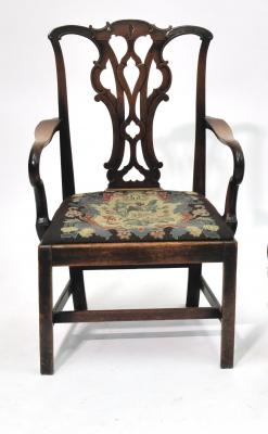 Appraisal: A GEORGE III MAHOGANY ELBOW CHAIR of Chippendale style waved