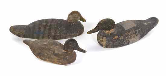 Appraisal: Three American Carved Wood and Polychrome Painted Duck Decoys comprising