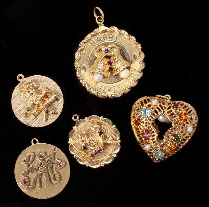 Appraisal: Five Gem Set Gold Charmsto include one of open heart