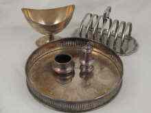 Appraisal: Silver plate being a boat shaped dish a toastrack a