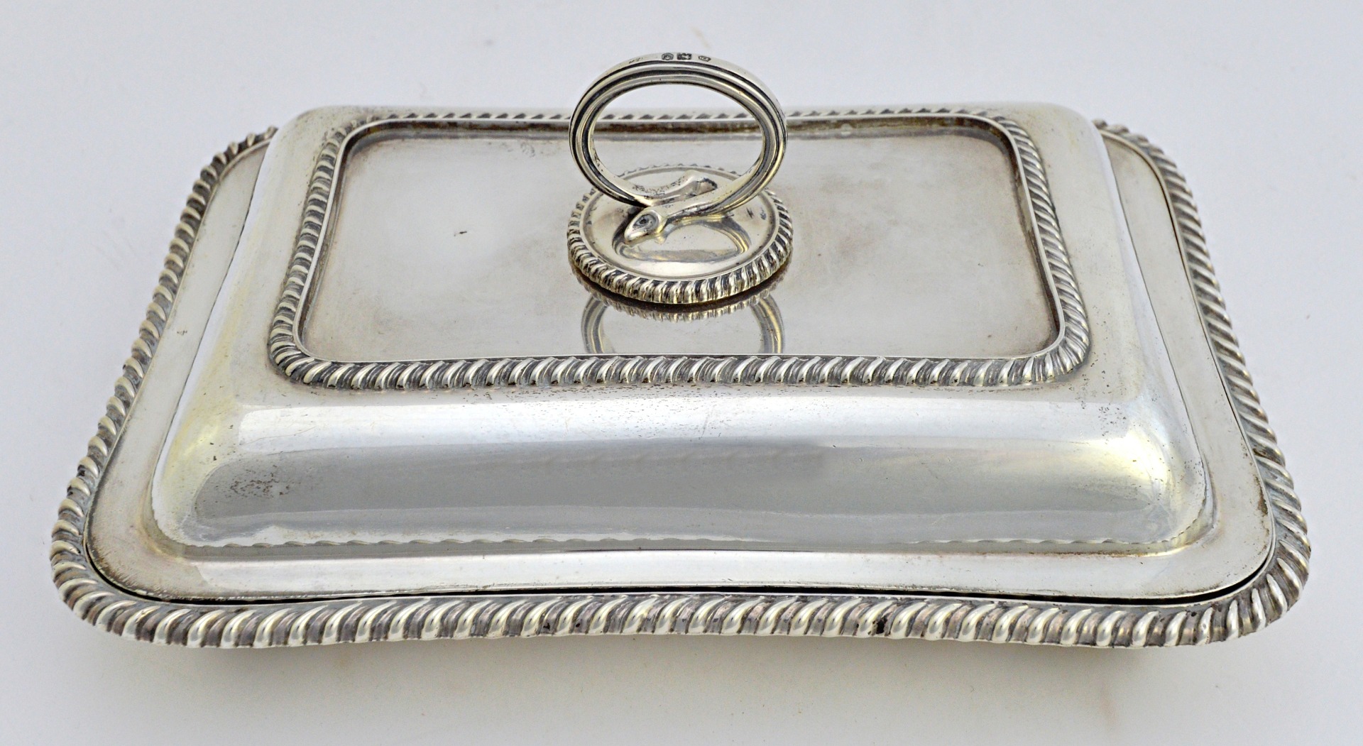 Appraisal: A late Victorian silver rectangular lidded entree dish decorated with