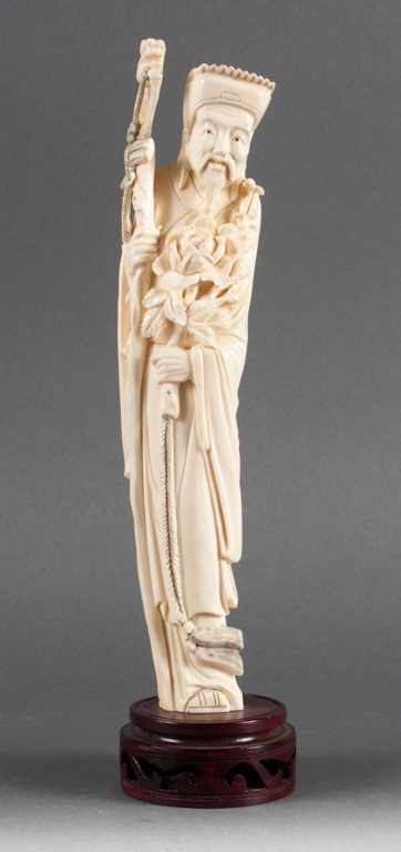 Appraisal: Chinese carved ivory immortal figure first half- th century modeled