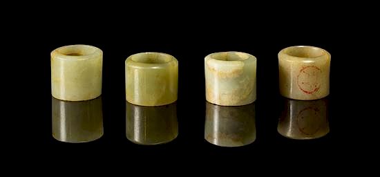 Appraisal: A Group of Four Jade Archer's Rings Diameter of widest