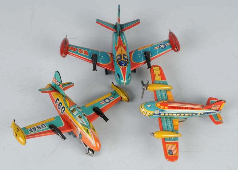 Appraisal: Lot of Tin Airplane Friction Toys Description Japanese Working Two