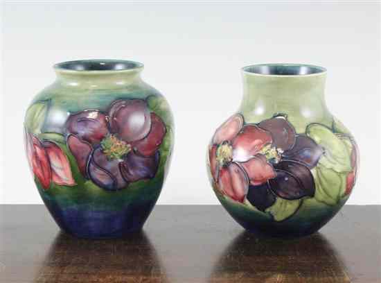 Appraisal: Two Moorcroft Clematis pattern vases post-war each with green blue